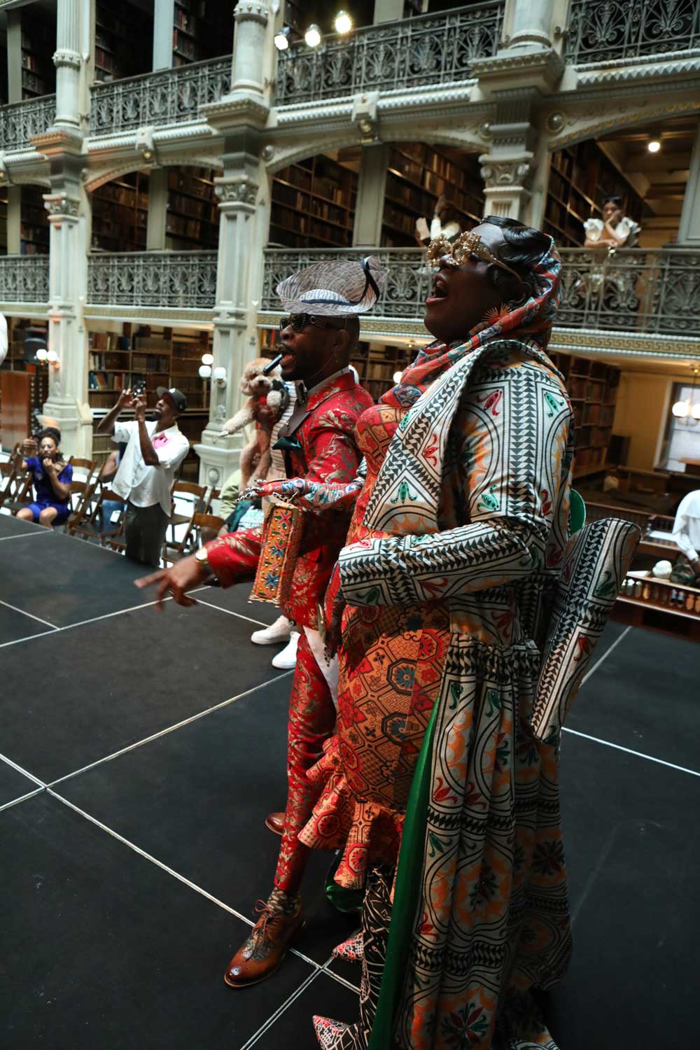 Two performers compete on the stage at the George Peabody Library