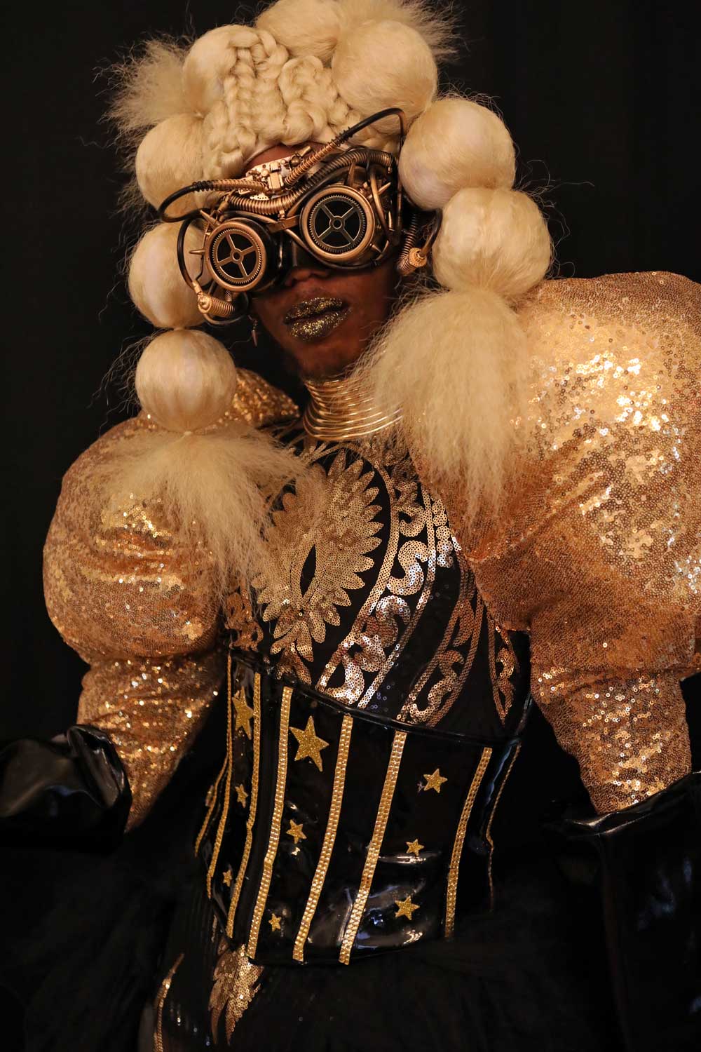 A performer in a futuristic costume
