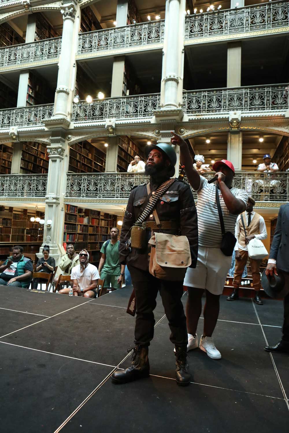 A performer on the stage at the George Peabody Library